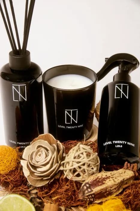 Hand reaching for Level Twenty Nine Interior Perfume